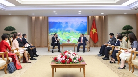 Thủ tướng Teh đak Phạm Minh Chính sơng pơma dơnuh hăm Kơdră chĕp pơgơ̆r Grŭp jang Abbott, Hoa Kỳ