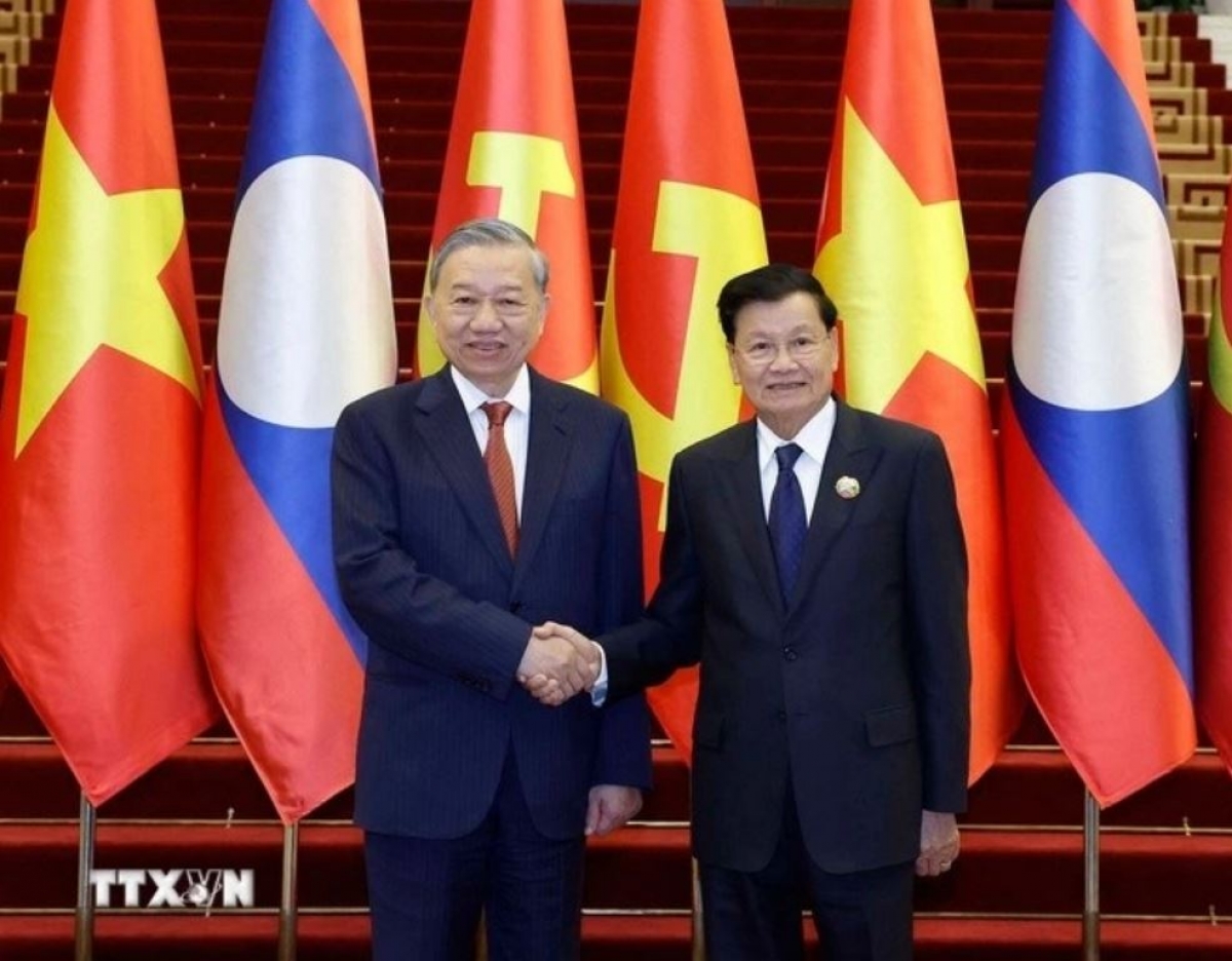 
Tổng Bí thư Tô Lâm păng Tổng Bí thư, Kơdră teh đak Lào Thongloun Sisoulith. Rup: TTXVN